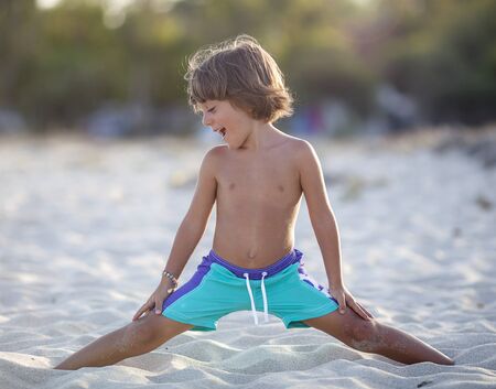 Baby plays on the beachの写真素材