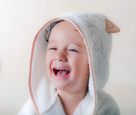 baby with bathrobeの写真素材