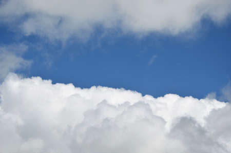 Many whites clouds on a blue sky