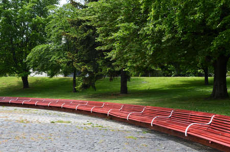 long curved bench in diameter stone square in the city parkの写真素材