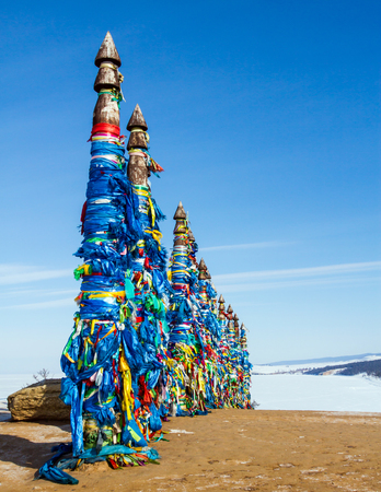 Shaman sacred place on lake Baikal. Ritual pillars on the island.のeditorial素材