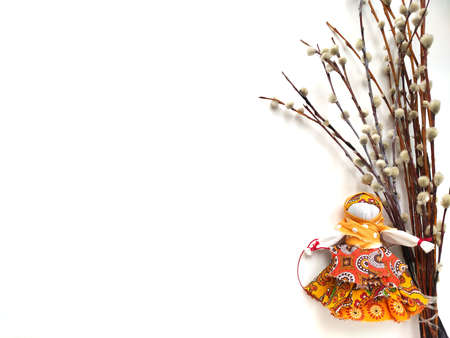 Background with textile doll and pussy-willow isolated on white for Maslenitsa festival.Traditional...
