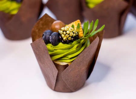 Sweet cupcake with fresh berries on white background. Selective focus. Close up.の写真素材