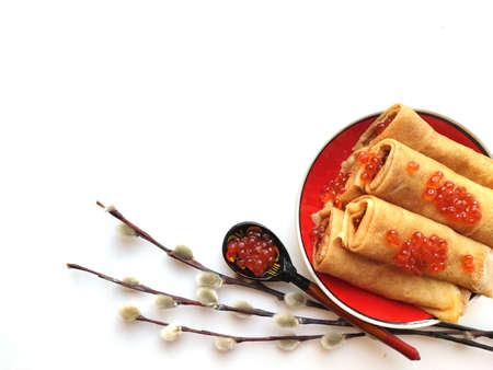 Background with pancakes and red caviar isolated on white for Maslenitsa festival.の写真素材