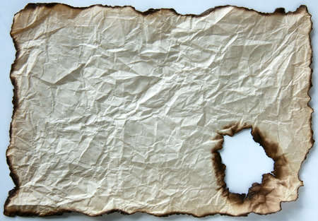 Old burnt crumpled edge paper, backgroundの写真素材