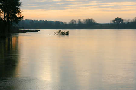 Cloudy sky and lake at sunset