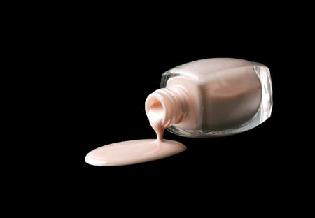 Close up of nail polish flow on black backgroundの写真素材