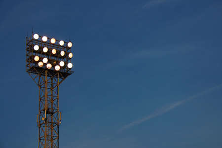 Stadium lights against evening sky backgroundの写真素材
