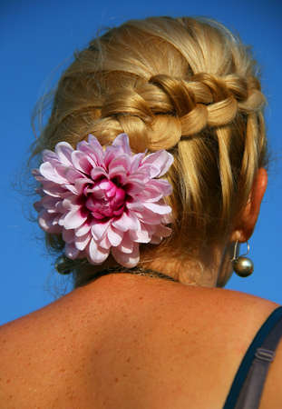 back view of beautiful haircut with flower