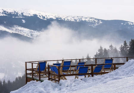 Sunbeds in the mountains at a ski resort Bukovel, Ukraineの写真素材
