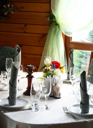 Served table with chairs in the restaurantのeditorial素材
