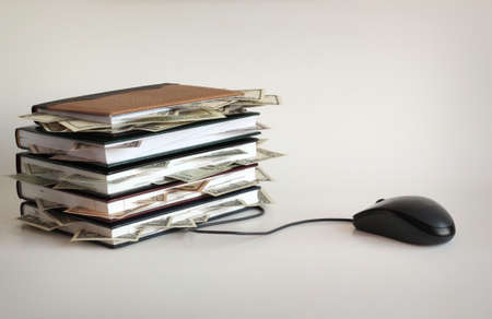 Computer mouse and notebook with money