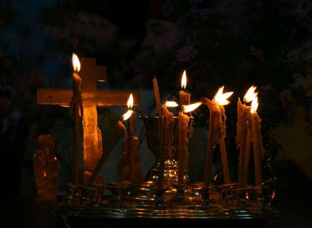 Candles and cross in the orthodox ukrainian church 