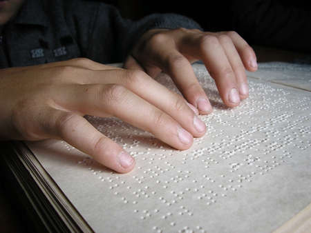Fingers and braille  Blind boy read a book in braille の写真素材