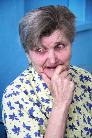 ZABOLOTTIA, UKRAINE - JUNE 11 - A sad old lady crying at shelter for single disabled people in Zabolottia on Julne 11, 2014. のeditorial素材
