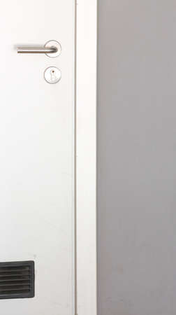 Grey wall and closed doorの写真素材