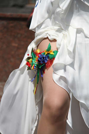 Floral wedding garter on leg of brideの写真素材