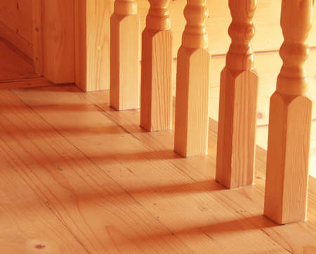 Wooden baluster at the bottom of a staircaseの写真素材