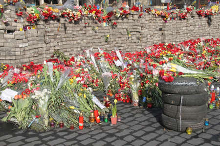 KIEV, UKRAINE - MARCH 7, 2014: Days of national mourning for killed defenders of Euromaidan. Lamps, flowers, and candles in commemoration of fallen heroes.のeditorial素材