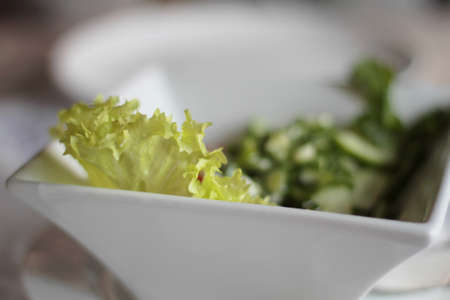 Fresh salad in a plate. Shallow depth of field.の写真素材
