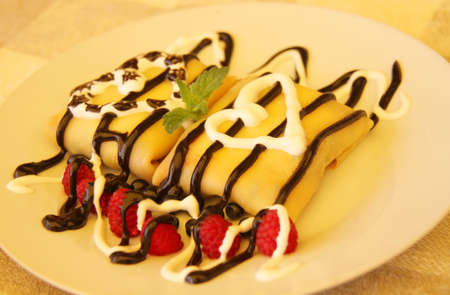 Pancakes with chocolate syrup. Shallow depth of field.の写真素材