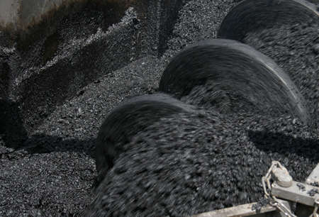 Asphalt manufacturing equipment. Shallow depth of field. The effect of motion.の写真素材