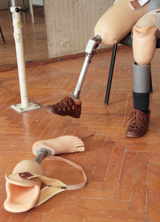 Male prosthesis wearer training in a special interior areaの写真素材