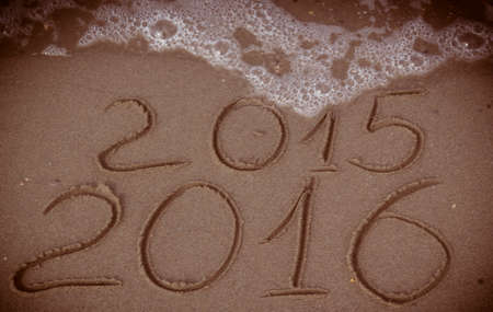 Happy New Year 2016 replace 2015 concept on the sea beachの写真素材