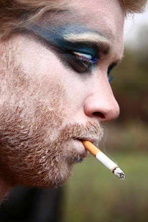 LUTSK - OCTOBER 31: Man smoking at Halloween on October 31, 2012 in Lutsk, Ukraine.のeditorial素材