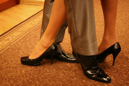 Romantic legs and shoes of a man and womanの写真素材