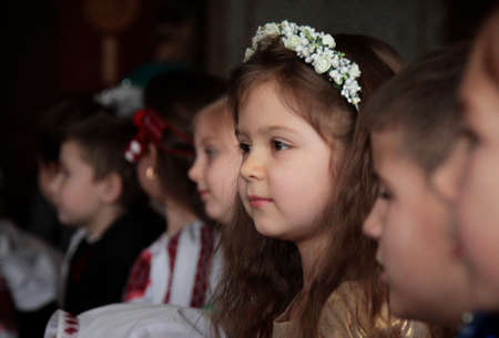 LUTSK, UKRAINE - DECEMBER 20 - Group of little children during holiday at school in Lutsk on December 20, 2016. Shallow depth of field.のeditorial素材