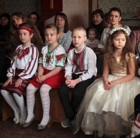 LUTSK, UKRAINE - DECEMBER 20 - Group of little children during holiday at school in Lutsk on December 20, 2016.のeditorial素材