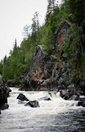 Threshold of the mountain river and wet stonesの写真素材