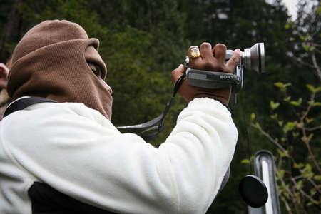 Lauterbrunnen Valley, Switzerland - May 05, 2009: Tourist from India shoots video in the Swiss mountains.のeditorial素材