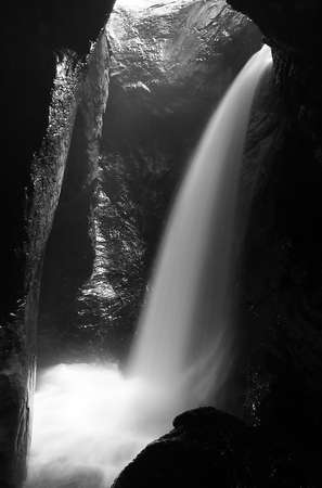 Waterfall at illuminated cave in the Lauterbrunnen Valley, Berne Canton, Switzerland.の写真素材
