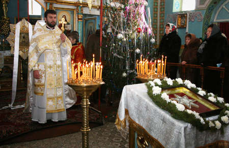 VOYUTYN, UKRAINE - 08 JANUARY 2009: Orthodox priest during Christmas serviceのeditorial素材