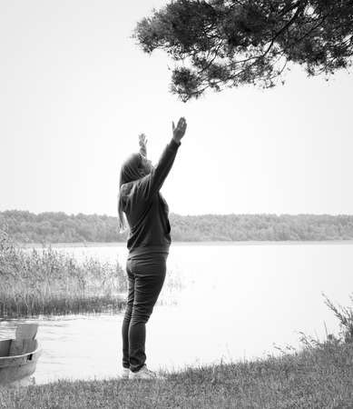 Woman meditating harmony with natureの写真素材