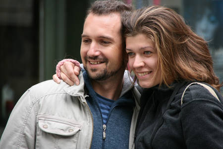 LUZERN, SWITZERLAND - 05 May 2009: Young couple hugging on the streetのeditorial素材