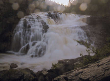 Waterfall on river at Kola peninsula, Russia. Vintage effects.