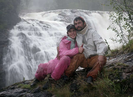 KOLSKY, RUSSIA - 12 AUGUST 2008 - Father and son near a waterfallのeditorial素材
