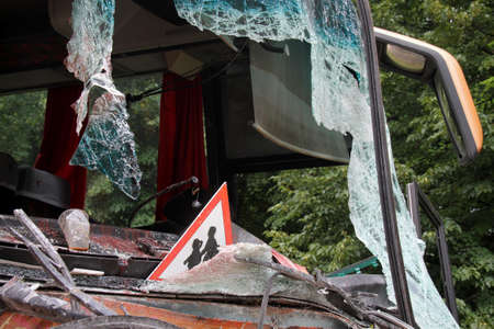 Warning sign children inside the bus with bloody broken glassの写真素材