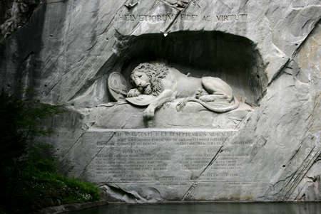 Lucerne, Switzerland - May 05, 2009: View to the Dying Lion monument. Carved in the rock to honor the Swiss Guards of Louis XIV of France.のeditorial素材