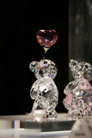 WATTENS, AUSTRIA - May 07, 2009: Bear with heart made with crystal Swarovski at Crystal Worlds (Kristallwelten) museum. Swarovski is an Austrian producer of luxury cut lead glass found in 1895のeditorial素材