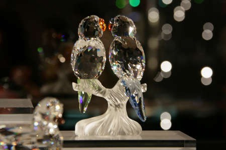 WATTENS, AUSTRIA - May 07, 2009: Couple of parrots made with crystal Swarovski at Crystal Worlds (Kristallwelten) museum. Swarovski is an Austrian producer of luxury cut lead glass found in 1895のeditorial素材