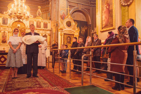 LUTSK, UKRAINE - 26 March 2017: The ceremony of christening the little girl at churchのeditorial素材