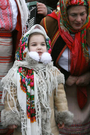 LUTSK, UKRAINE - 11 January 2009: Granddaughter and grandmother celebrates Christmas on the streetのeditorial素材
