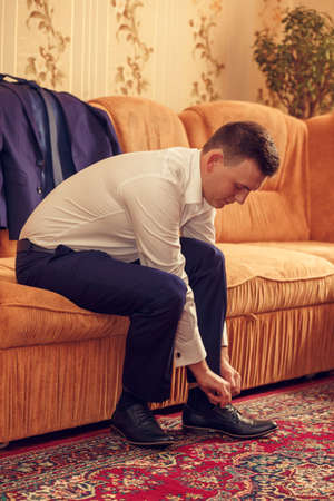 VILHIVKA, UKRAINE - 21 May 2017: Groom wearing classic shoes on wedding dayのeditorial素材