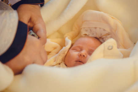 LUTSK, UKRAINE - 26 March 2017: The ceremony of christening the little girl at churchのeditorial素材