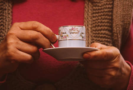 Woman holding cup of coffeeの写真素材