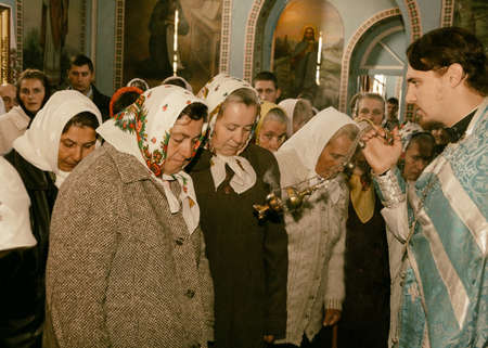 VOYUTYN, UKRAINE - 14 October 2008: Priest holding smoking incense during the religious celebration Pokrovのeditorial素材